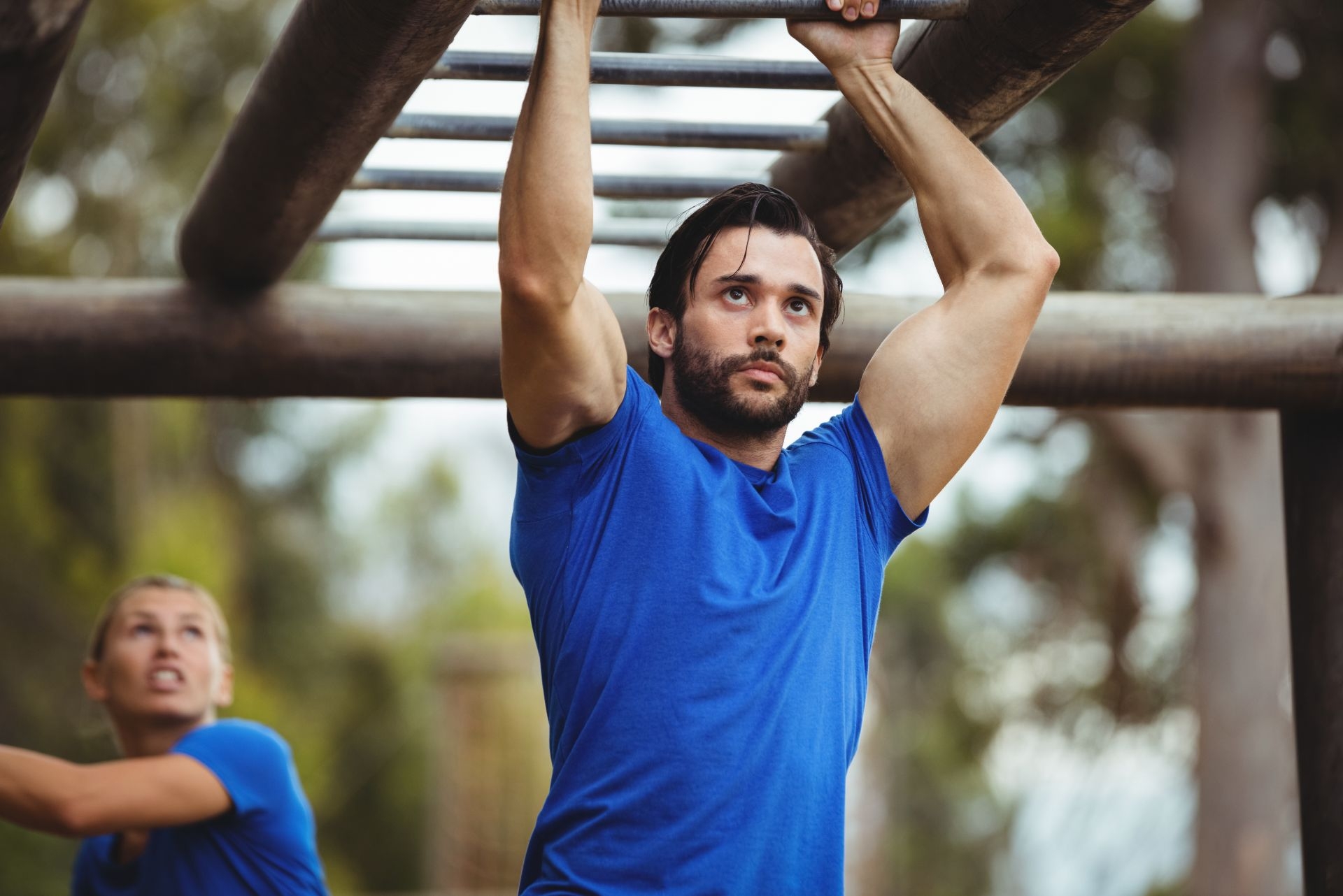 man hanging from a ladder